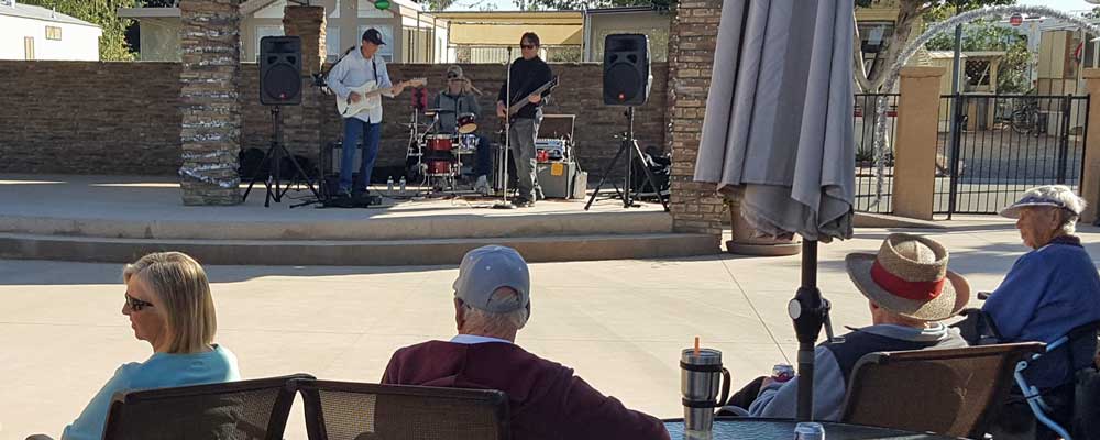 Arriving at our new RV parking location to a live band at the clubhouse