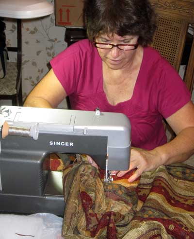 Sandy working at the sewing machine