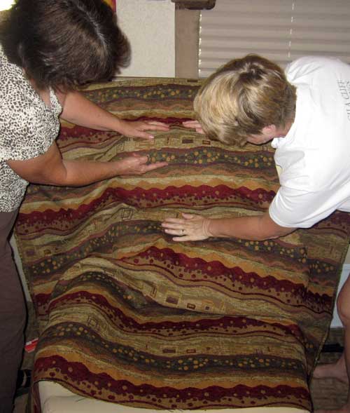 Sandy and Gwen examine the new upholstrey fabric