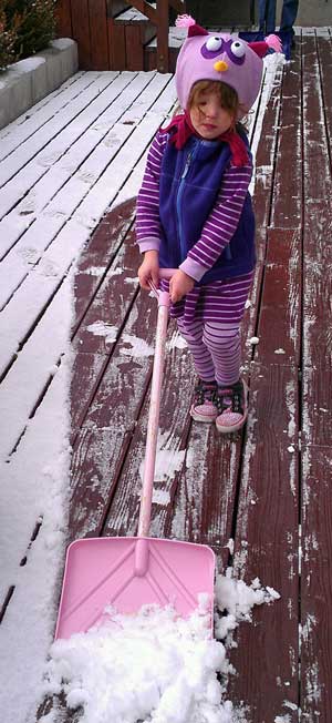 Chloe shoveling the snow off her deck in Reno, NV
