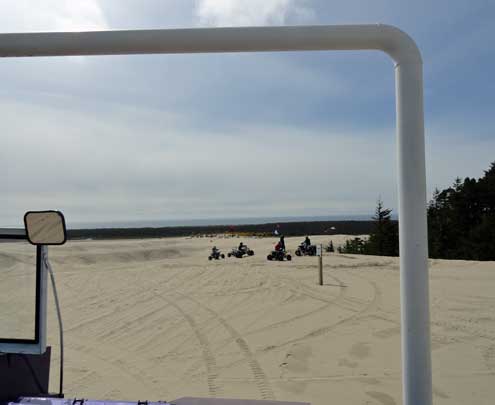 Some 4 wheel ATVs in the distance on the Oregon Dunes