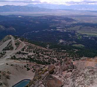 The city of Mammoth Lakes in the distance; Behind: a Panorama of Mammoth Lakes and the view east