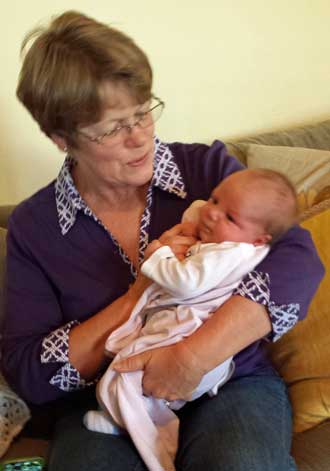 Gwen with Lucy, Behind: the four generations.