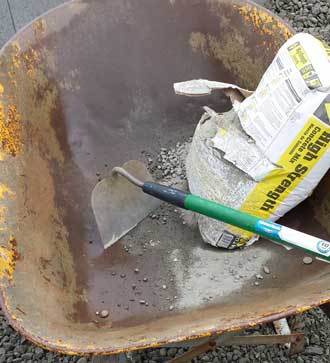 mixing cement for the first time in a long time, Behind: the beginning of the clothesline pad