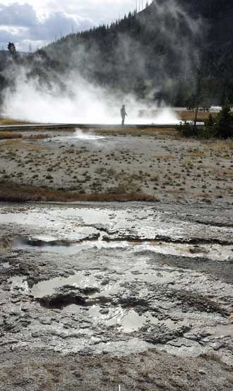 Midway Geyser pools, Behind: one of the many high temperature pools