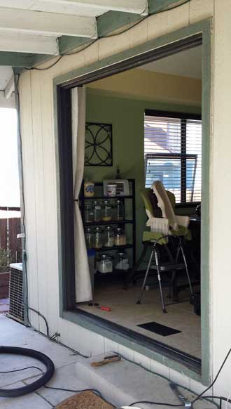 Sliding door removed, Behind: vacuuming the artificial grass