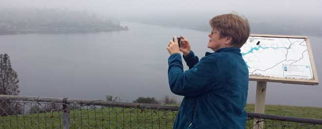 Gwen photographing a foggy Pardee Reservoir