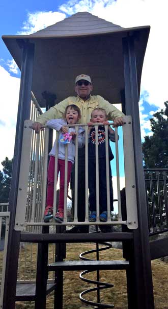 Grandpa with Chloe and Noah on the play equipment