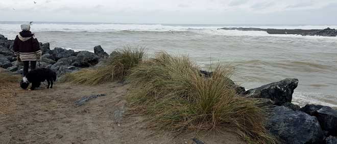 The Coquille River meets the Pacific Ocean, a stormy day behind this photo. 