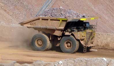 The trucks move the ore to the crusher