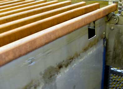 The copper in solution is attracted to stainless steel plates then shaken loose, stacked on 3 ton pallets. 