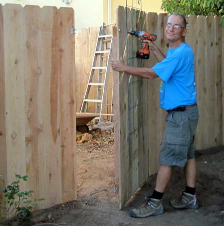 Dale poses with the last screw into the gate