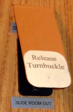 Release Turnbuckle Warning Sign over switch