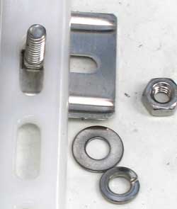 Carriage bolt, flat washer, lock washer and bolt used to secure cover