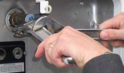 Two wrenches may be needed to remove the valve.