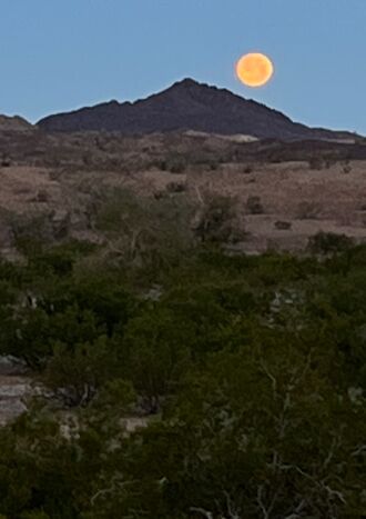 The moon setting, then click for the sun rising