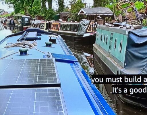 Passing a row of parked narrowboats