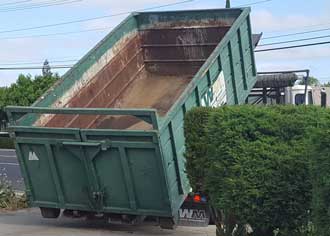 The dumpster arrives