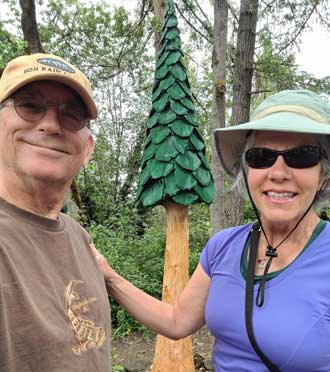 Dorana and me with a chainsaw carving