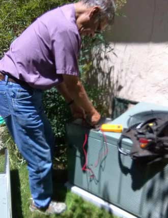 Lee checking the heat pump