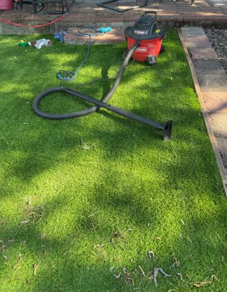 Vacuum the Artificial turf