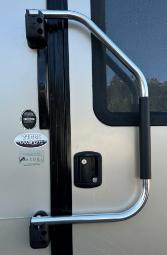 Handle folds against the door for travel