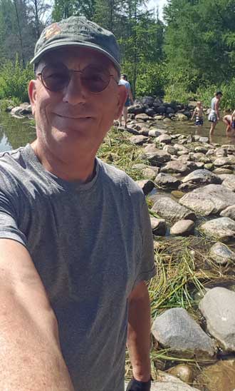 The Mississippi River is right behind me, rocks so you can walk across