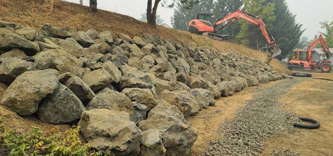 The large and small excavators work together