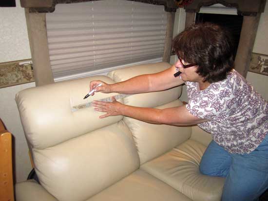 Sandy at work drawing match lines on the old fabric