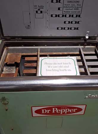 Vintage bottle coin machine