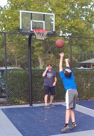 Noah and dad at the basketball court