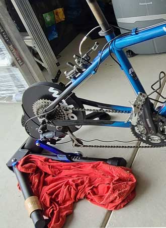making adjustments to the bicycle on the Kickr