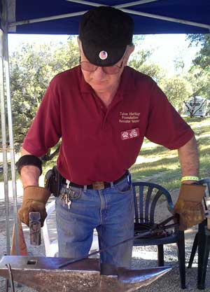 JD demonstrates blacksmithing