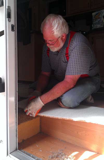 Tom is installing our new carpet