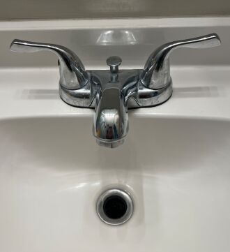 The old ugly bathroom faucet