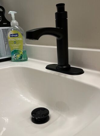 The new faucet helps the bathroom look much better