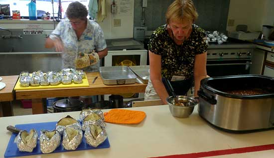 Preparing baked potatoes for the Chapter 9 potluck