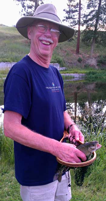 Ralph shows off the fish he caught