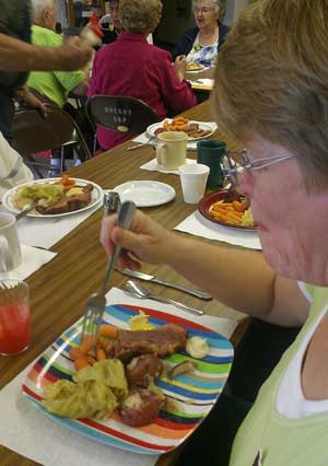 Gwen enjoys her corned beef, carrots, cabbage and potatoes