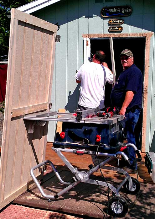 Randy and Greg install a new door on our shed