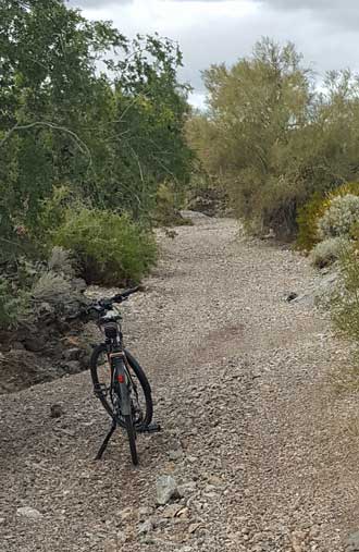 I hate riding in a wash, gravel is too deep.