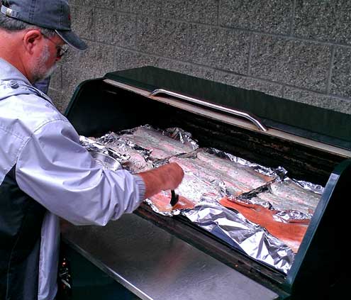 Kimm is cooking the salmon purchased locally