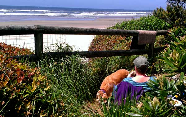 Gwen enjoying the beach view just behind our trailer in site 48