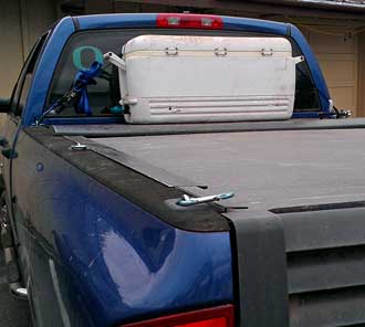 Preparing to fill the 25 gallon ice chest with water, Behind: borrowing wate with permission from Sisters Ace Hardware