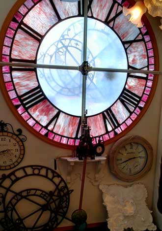 Beacham's Clock Shop, large clock viewed from the street, Behind: clock movement for street view clock.