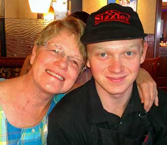 Gwen and grandson Dustin in Klamath Falls Sizzler, Behind: bridge over Willow Creek leading to our campsite