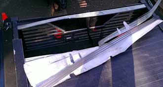 Bear damage to the tonneau cover, Behind: Rear view of the damage.