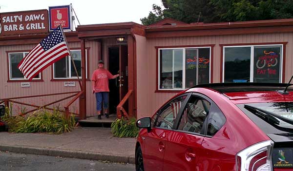 Gwen found one of our favorite restaurants in Waldport, Behind: Ripping CDs in the Waldport Library