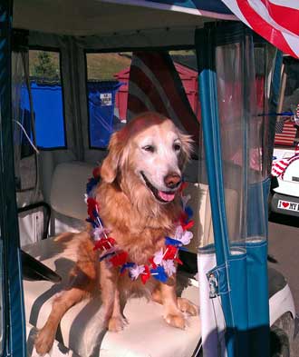 Morgan is ready for the parade, Behind: Dale and Morgan in Don and Irenes golf cart