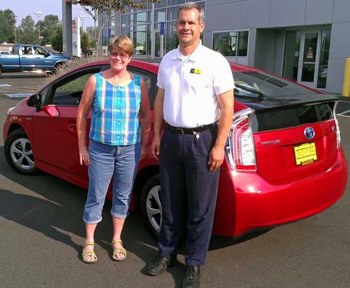 Gwen with Will Baas, or salesman, Behind: a group photo